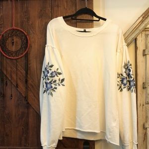 XL white sweater with blue flowers on sleeves